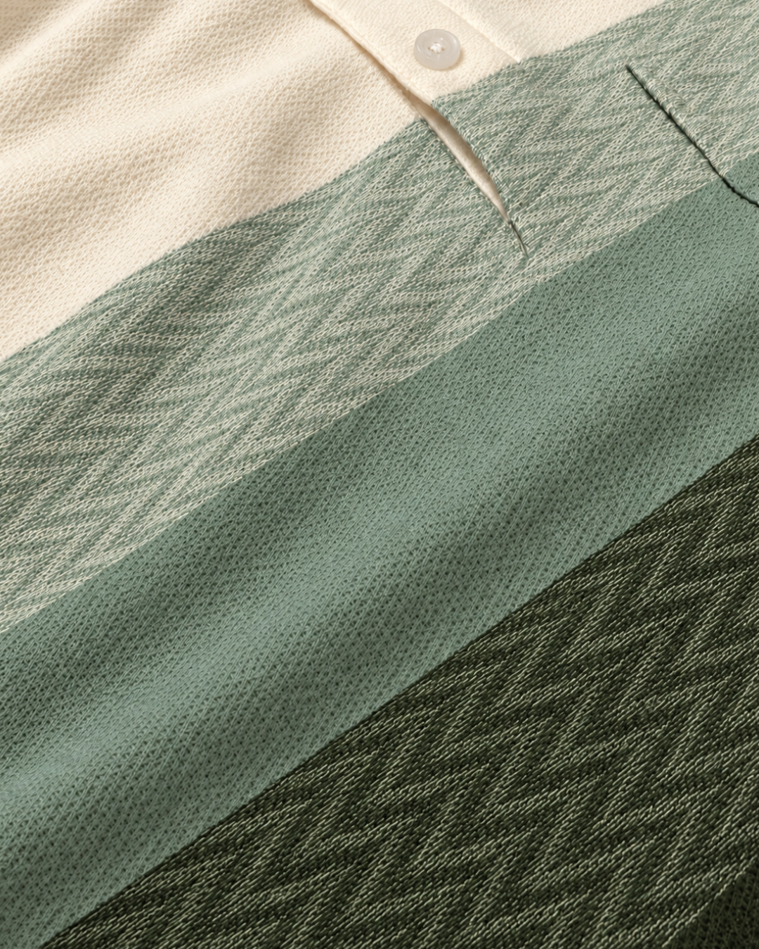 Close-up of The Ombre Stripes Designer Polo fabric in Forestry Green, showing jacquard chevron knit and piqué-style stripes