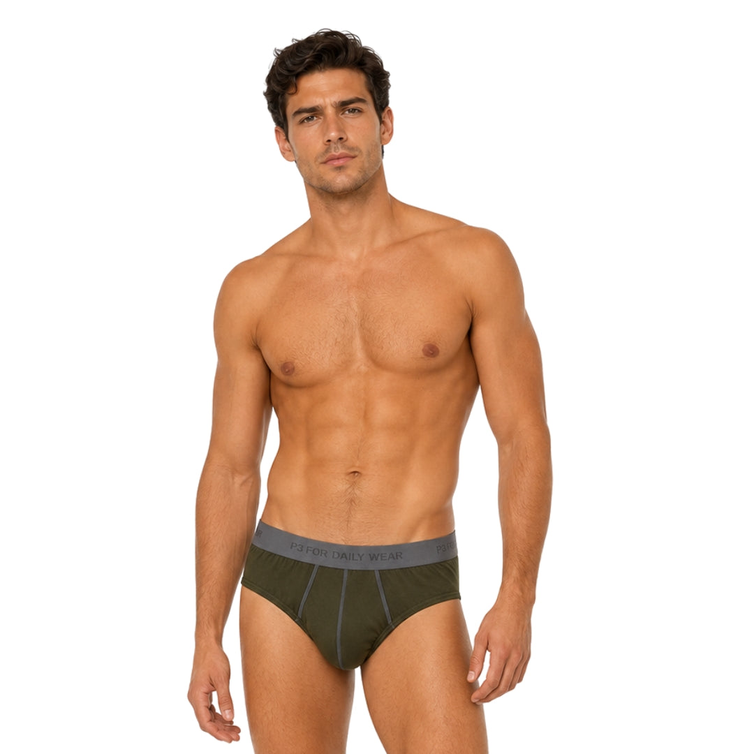 A male model wearing dark olive green briefs with a gray waistband, photographed against a plain white studio background.