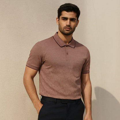 Man wearing a brown polo shirt against a beige background