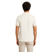Male model wearing Vanilla Frost Vertigo Vertical Designer Polo, back view