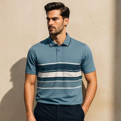 Man wearing a blue striped polo shirt against a beige wall