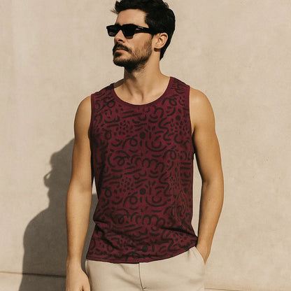 Man wearing a patterned sleeveless shirt against a beige wall