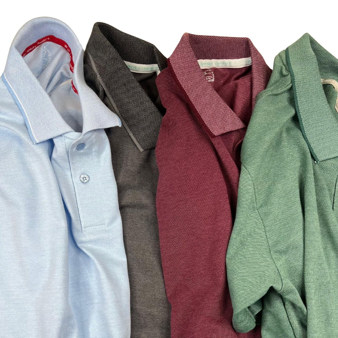 Four folded polo shirts in different colors arranged in a row.