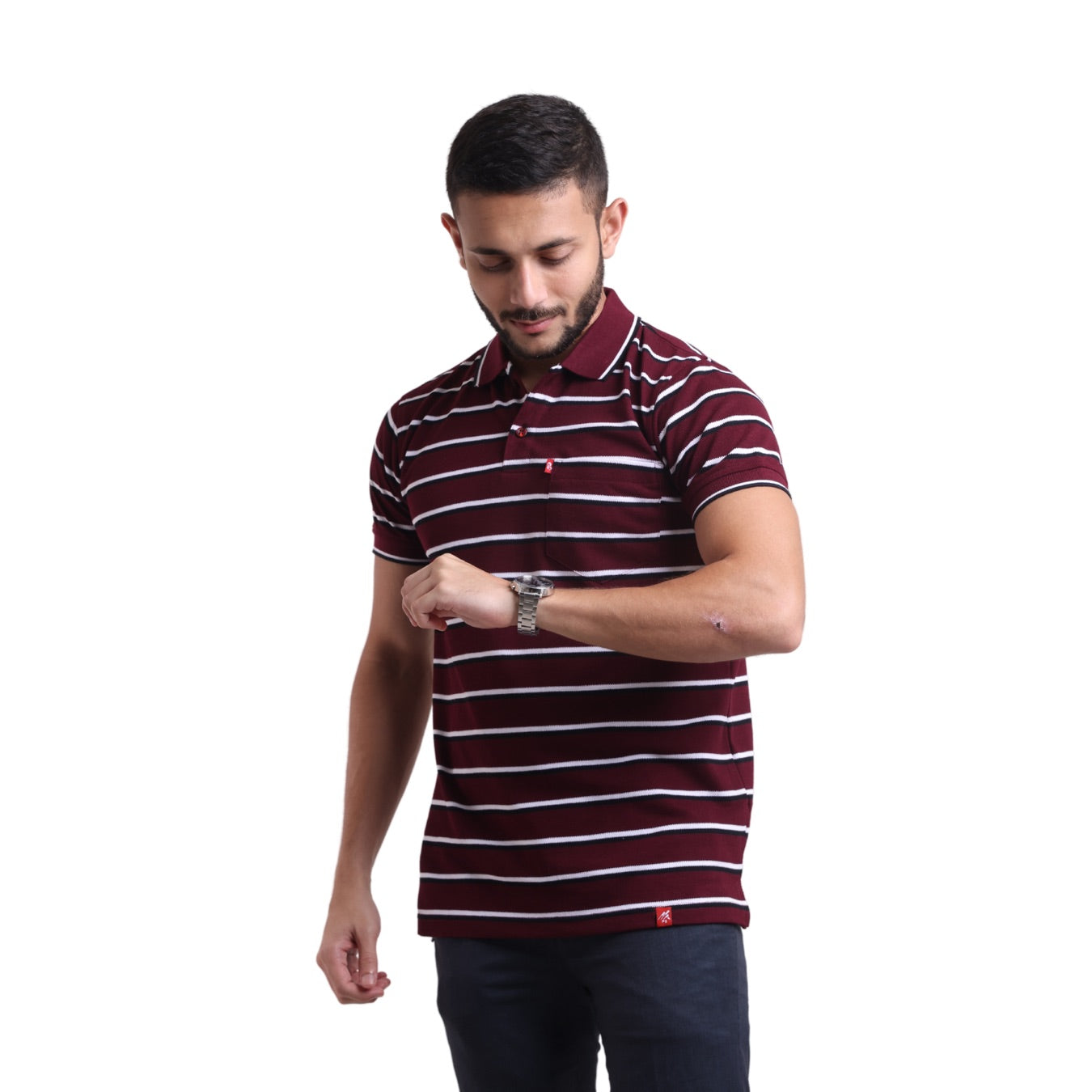A man wearing a red and white striped polo shirt with contrasted stripe detailing on the cuffs and collar.